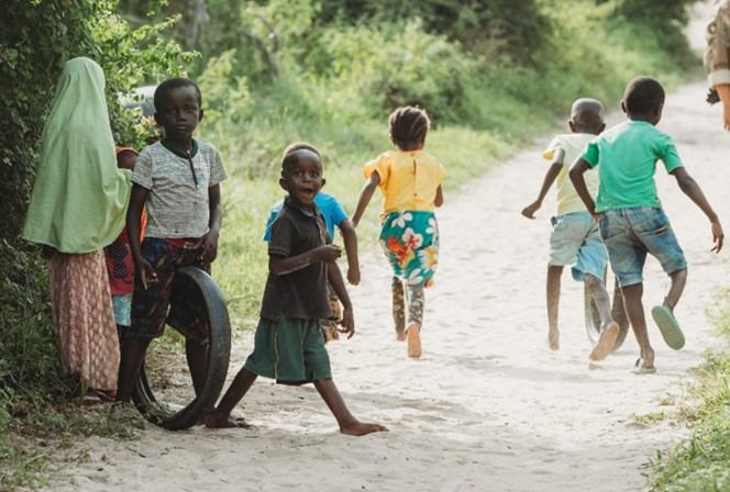 Children playing on a village path