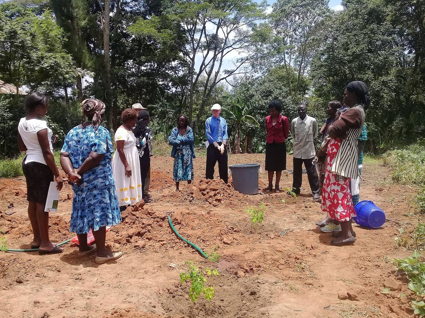 Community members planting tree seedlings